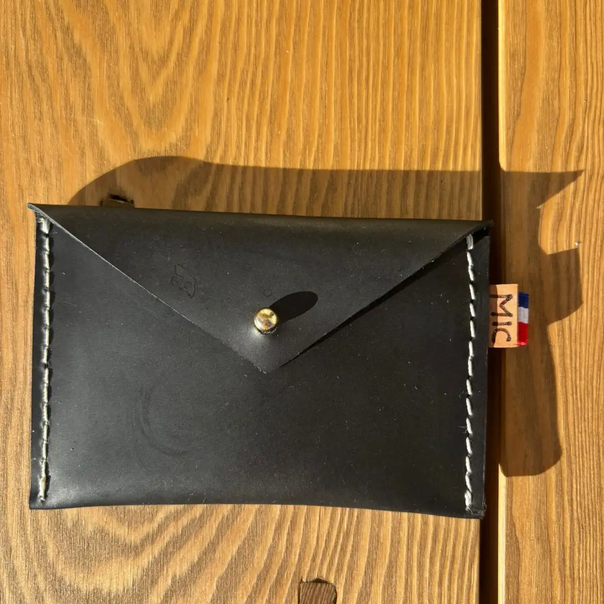 Petite pochette en cuir noir lisse