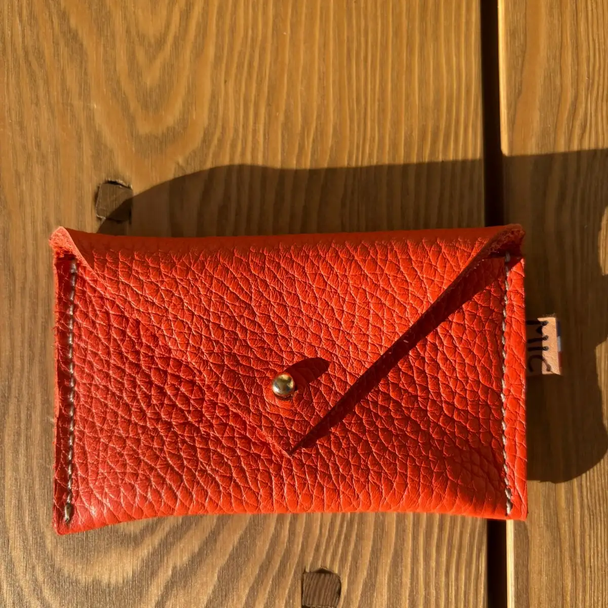 Petite pochette en cuir grainé orange