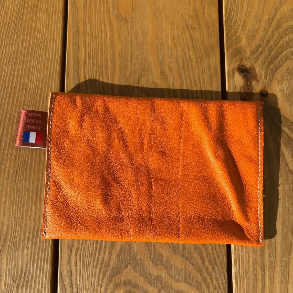 Moyenne pochette en cuir lisse orange
