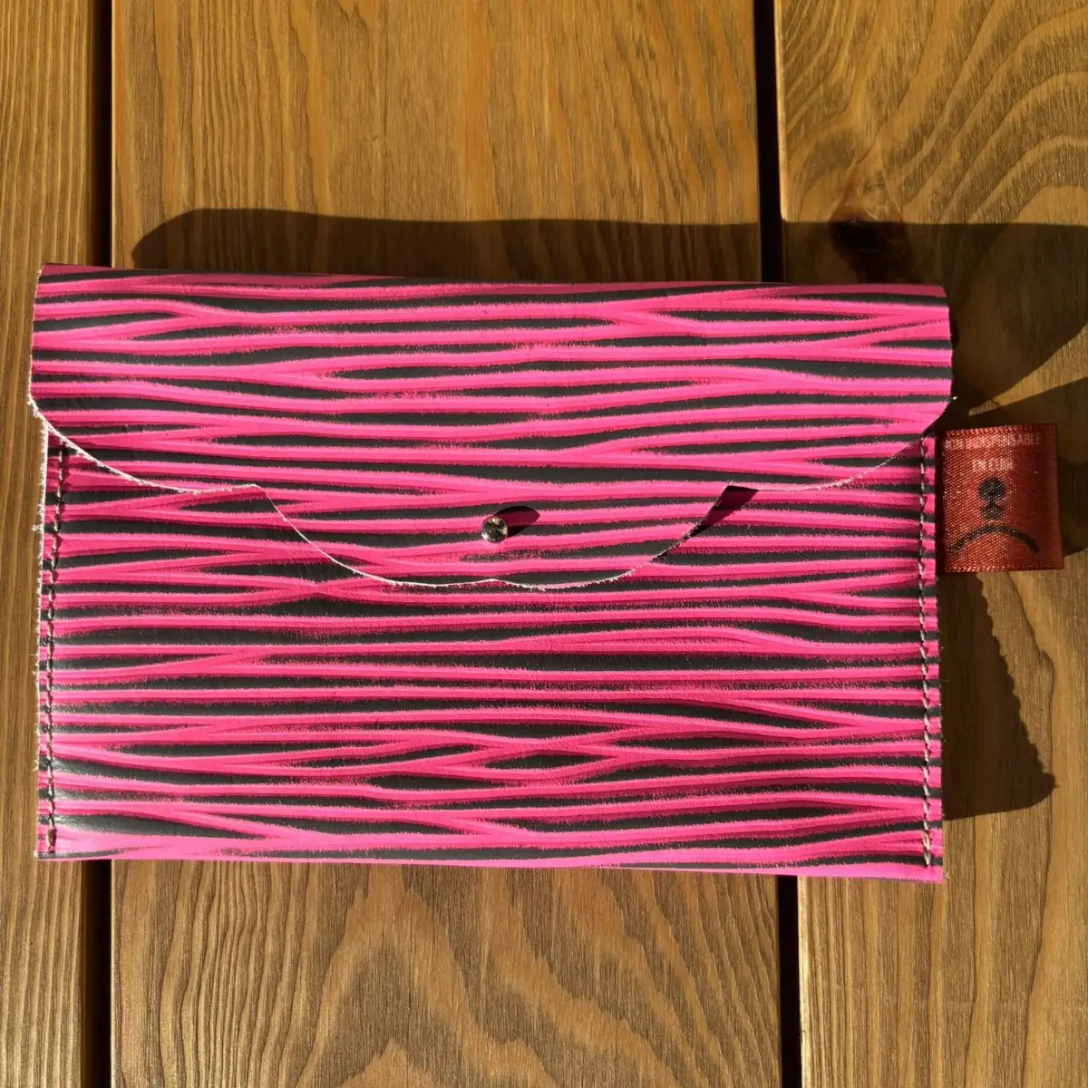 Moyenne pochette en cuir épi rose et noir
